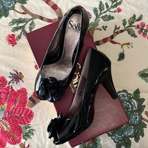 Soft Brand Black Patent Heels with peep toe and flower on toe. New in box